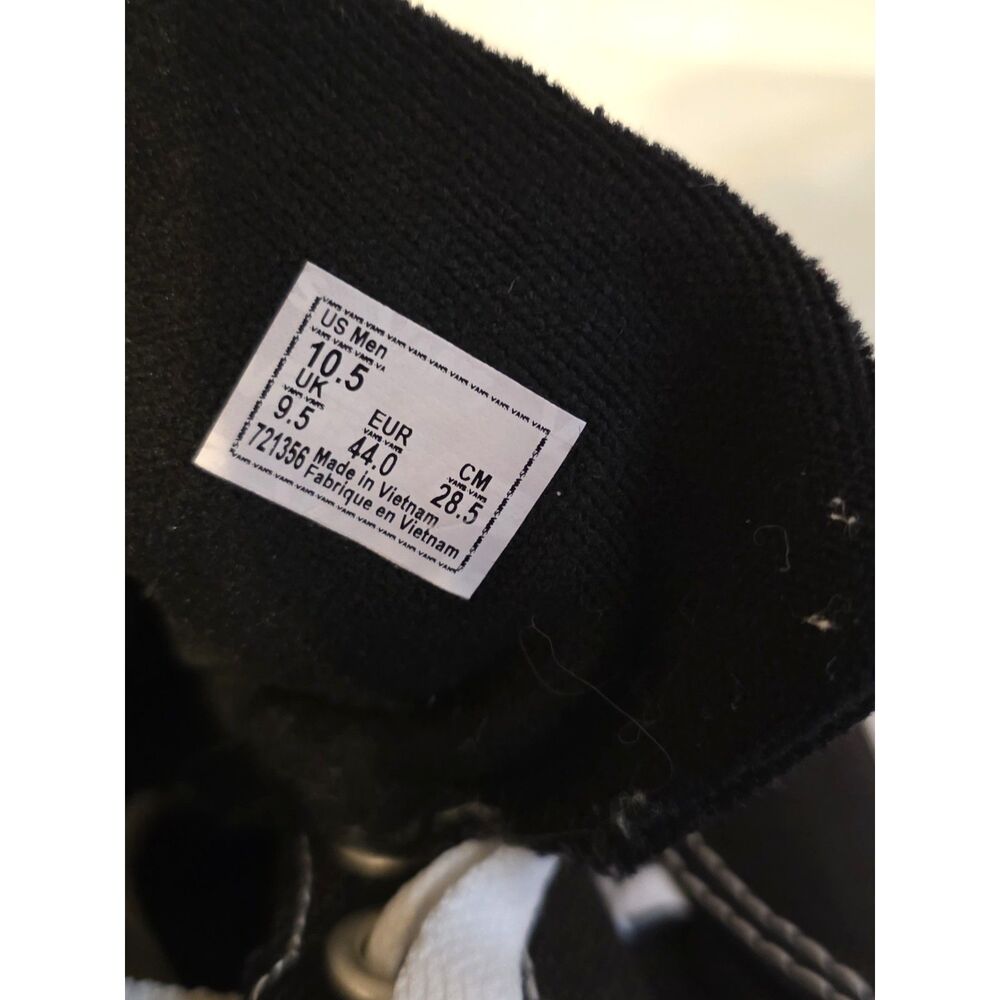 These are black Vans Authentic sneakers with white laces. - Picture 4 of 9